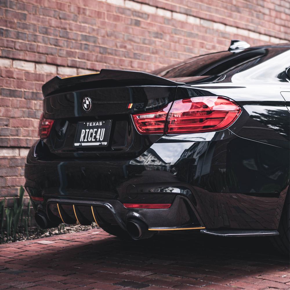 bmw m3 m4 f80 f82 psm style carbon fiber spoiler installed angle view