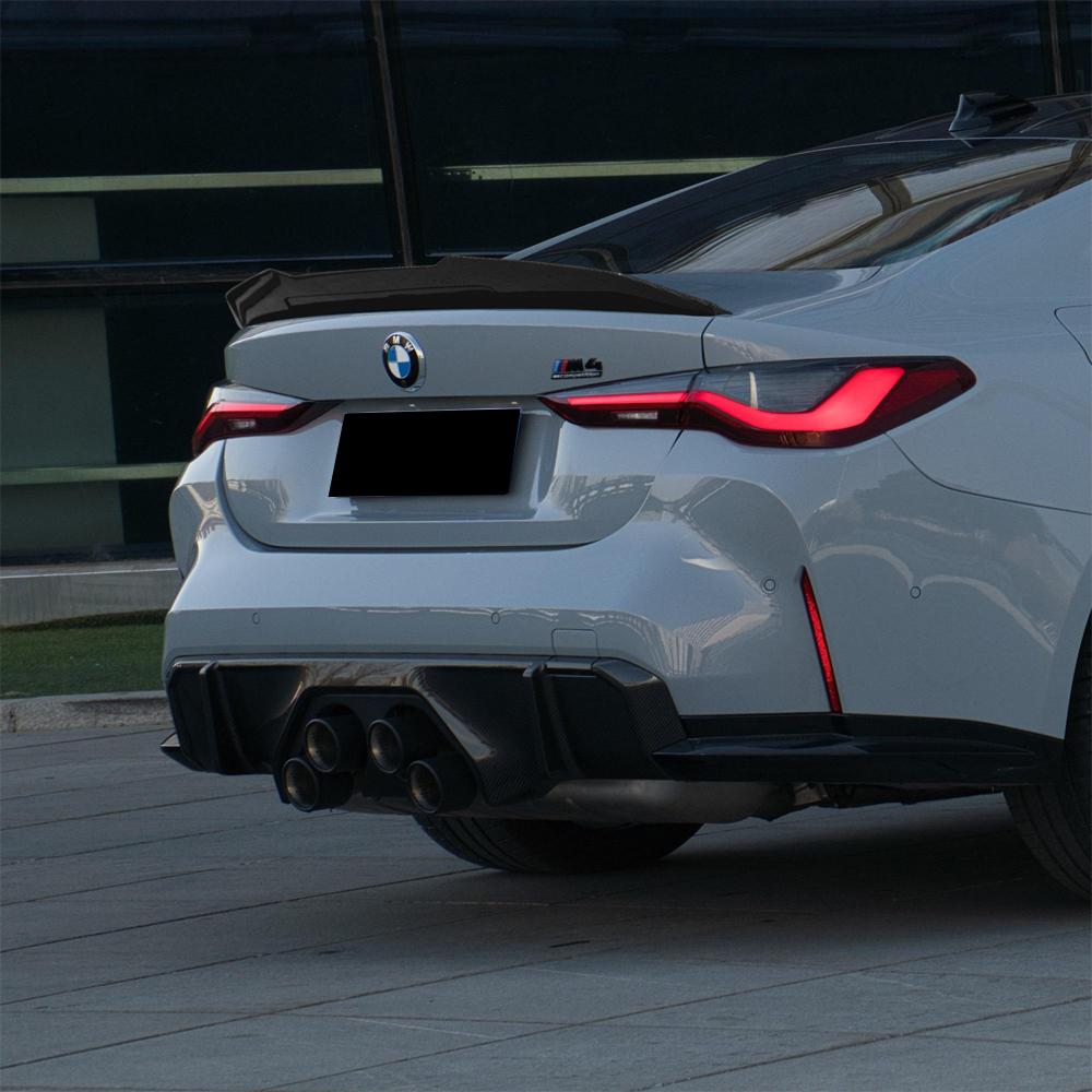 bmw m4 g82 psm style carbon fiber spoiler installed angle view